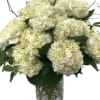 Dreamy pillows of cloudlike hydrangeas, designed with elegant designer greenery and added