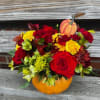 Fall arrangement using roses, alstroemeria and cushion daisy in a red and