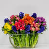 Celebrate spring's most vibrant blooms with this sophisticated arrangement. A lush clusters