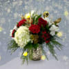 Snuggle up with holiday warmth through  this bouquet composted of roses