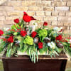 A Beautiful Fresh Arrangement Filled With Holiday
Greens, Pine Cones, Birch Logs and