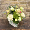 Fresh Arrangement Using an Assortment of Lisianthus,
Hydrangea, Roses, Cymbidium Orchids in a