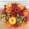Vibrant and festive blooms in fall tones and textures.  Florals may