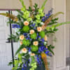 Seasonal selection of colorful flowers for a large space. Includes the easel.