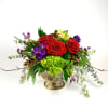 Vivid red roses, purple stock and apple green cymbidium orchids with winter