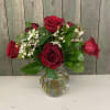 This design features 6 classic red roses arranged with premium filler flowers