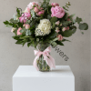 A luxurious floral composition designed to impress. This bouquet combines the fullness