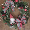 A plush Gnome adorns this 24&quot; silk Christmas wreath decorated with 