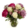 A graceful blend of color and charm, this arrangement features 3 white