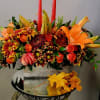 Fresh fall florals arranged in a wooden rectangular box and accented with