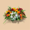 A vibrant harvest centerpiece brining a warm, abundant, glow to any Thanksgiving