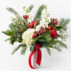 Fresh and vibrant. This vase of red and white flowers is about