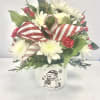 This cute Frosty container full of fresh flowers will surely warm the