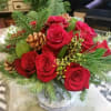 Lush red roses, fresh white pine, pine cones...