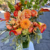 Welcoming the fall with rich tones of Orange Calla lilies, Orchids, Proteas