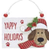 Distressed wooden plaque ornament with raised puppies wearing tin Santa hats and
