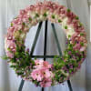 Honor a cherished memory with this elegant memorial wreath, crafted with premium