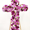 Celebrate faith and inner beauty with this elegant cross arrangement, crafted in