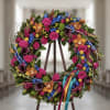 The Vibrant Remembrance Wreath is a deeply artistic and profoundly colorful tribute