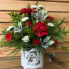 With frosty berries and a happy snowman, this arrangement is the perfect