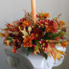 Rustic, fall arrangement with a candle to accompany your family dinner!