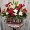 Christmas Center Piece in a Wooden Box Filled with Joyful flowers. 
