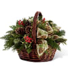 Holiday evergreens overflowing in a basket with ribbon, berries, pinecones, and holiday