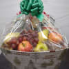 Send some holiday cheer with this fruit basket filled with a large