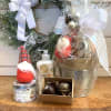 This standard Peace on Earth gift basket includes a gnome, a two