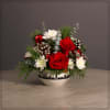 Roses, mums, Cones, Ornaments and mixed Holiday greens in our Exclusive Kc