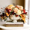 Gorgeous arrangement of soft fall colors in stunning vase 