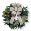 This beautiful wreath has pinecones and big bow with printed snowflakes.