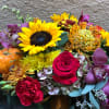 Assortment of fall tones flowers to accent your culinary talents! This arrangement