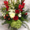 This tall, seasonal arrangement comes complete with red and white gladiolas, hypericum