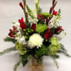 This winter inspired arrangement comes complete with spider mums, snapdragons, dianthus, gladiolas