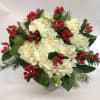 This vase arrangement is filled with holiday cheer! Feauturing hydrangea, pine, and