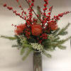 This winter inspired arrangement comes complete with pin-cushion proteas, Ilex berries, hypericum