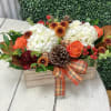 White Hydrangea, Orange Roses, Burgundy Carnations, Bronze Mums, Hypericum, Pinecones, Assorted Filler