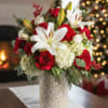 Celebrate the season in classic holiday style with snowy white lilies, vibrant