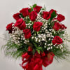 24 long stem red roses in clear vase with filler flower and