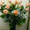 Peach  Roses  in a Tall vase with Fancy Greens
OR
Call the