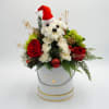 This includes a Carnation White, mini hydrangea green, red roses, Red Christmas