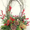 Christmas Nest Basket of Ilex berries curly willow lotus pods christmas greens