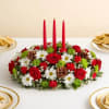 Send yuletide greetings in classic style. Our charming Christmas centerpiece is hand-arranged
