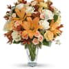 Capture the natural beauty of autumn with this stunning arrangement of lilies