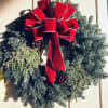 A 20&quot; Fresh mixed pine wreath crafted with a Red Bow &amp;