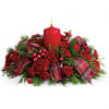 A beautifully designed centerpiece featuring Carnations, Hypericum Berry, and fragrant Christmas Greens.
