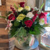 Fresh mix of seasonal blooms, like lily&#039;s, chrysanthemums, hydrangea, carnations, real pinecones