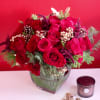 Capture the magic of the season with our enchanting Christmas floral arrangement