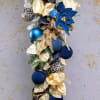 The Royal Blue Swag is a regal holiday decoration that combines the